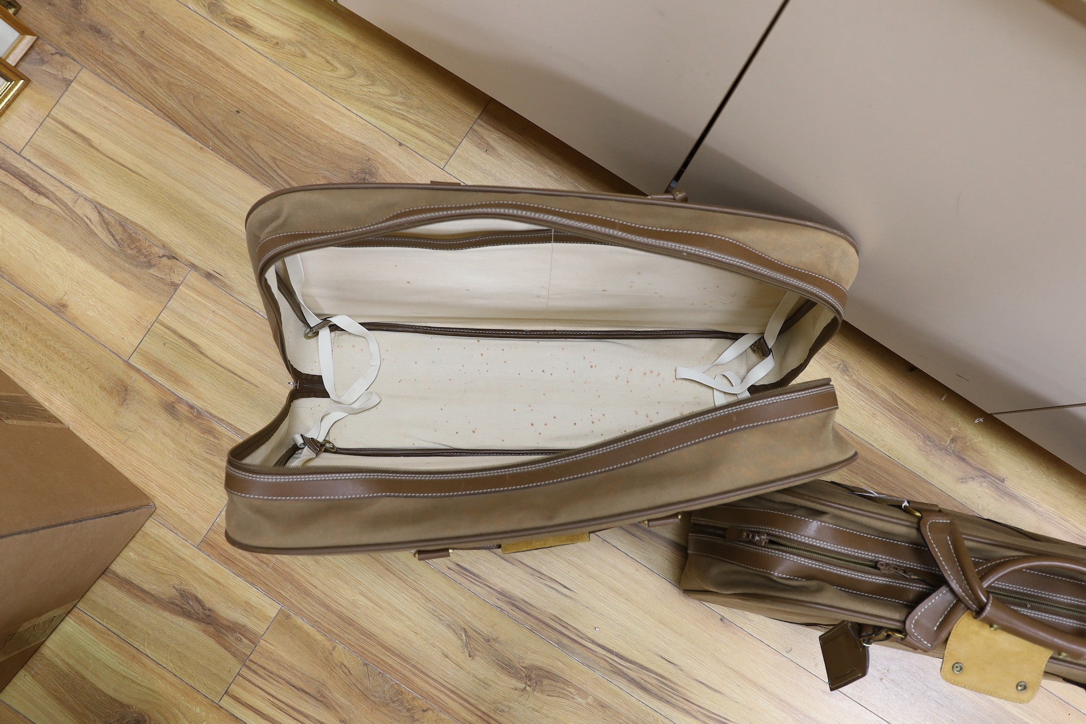 Two 1980's soft canvas Dunhill suit cases, largest 65 cms wide x 42 ms high.